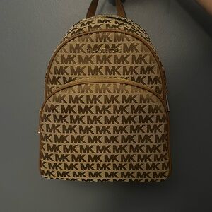 Michael Kors. Backpack purse. Brown leather gold accents